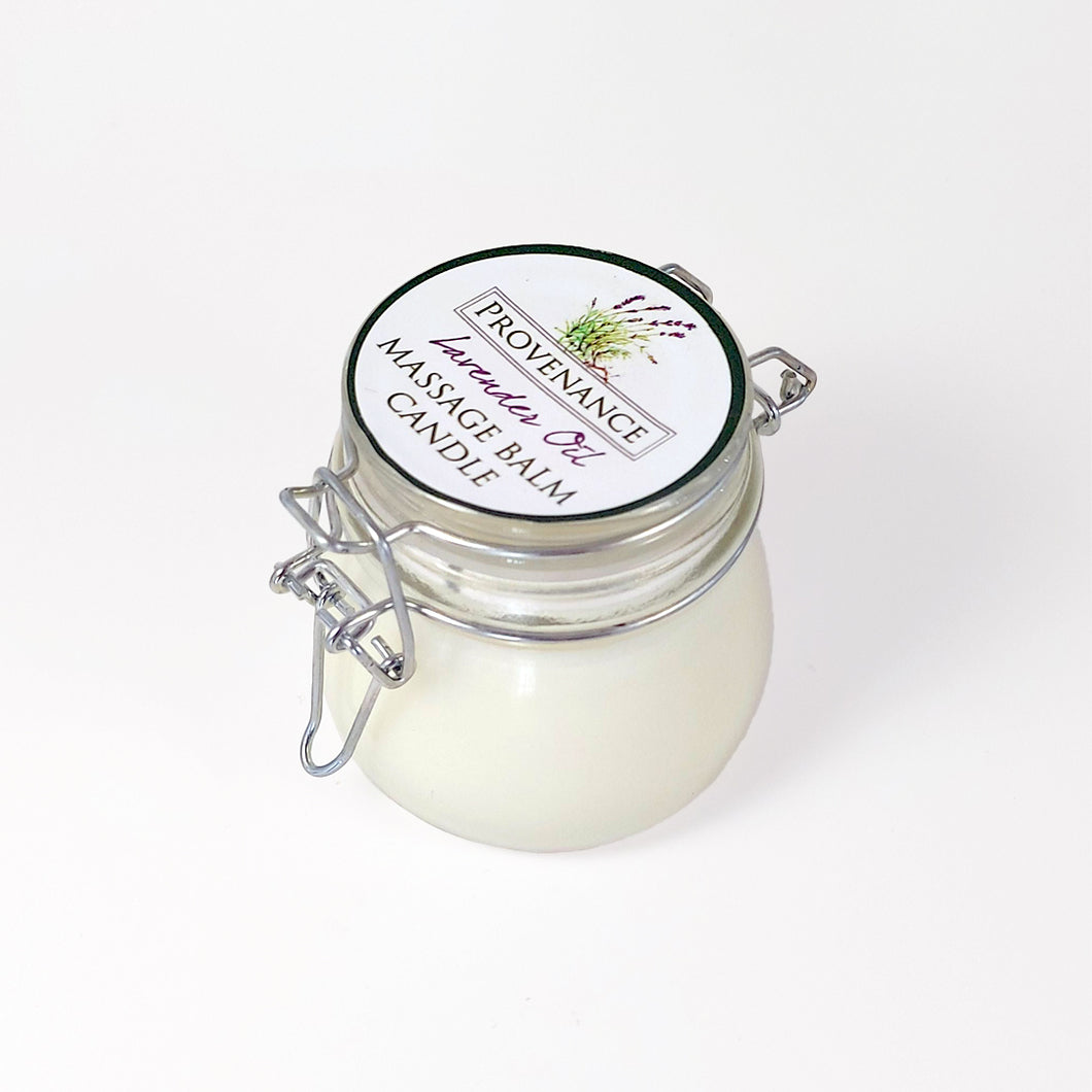 Massage balm candle in clear glass jar with confectionary clamp lid.