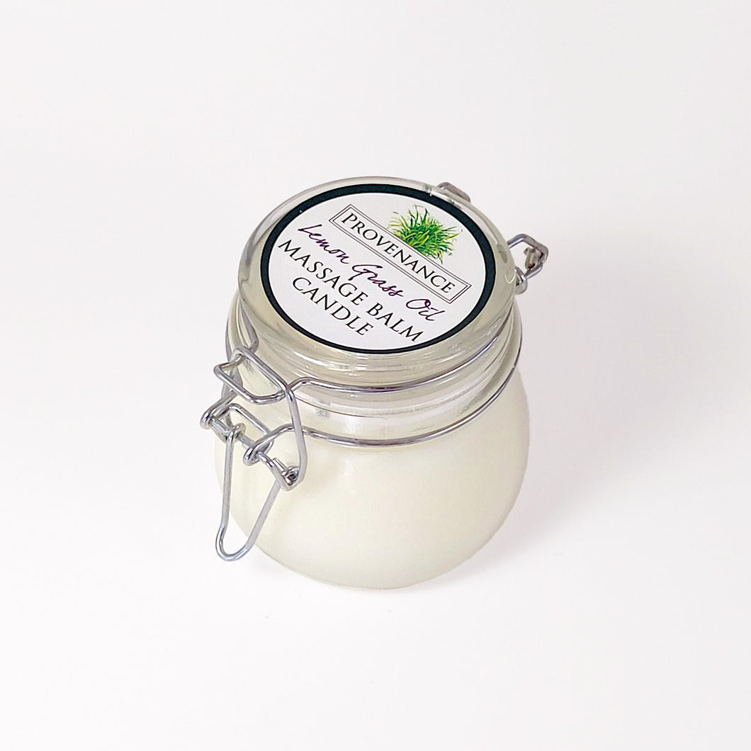 Massage balm candle in clear glass jar with confectionary clamp lid.