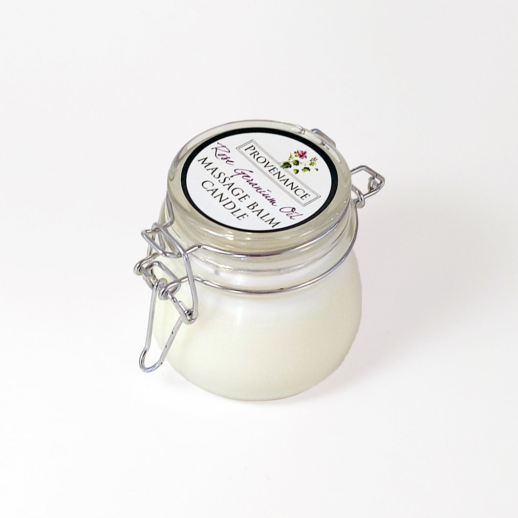 Massage balm candle in clear glass jar with confectionary clamp lid.