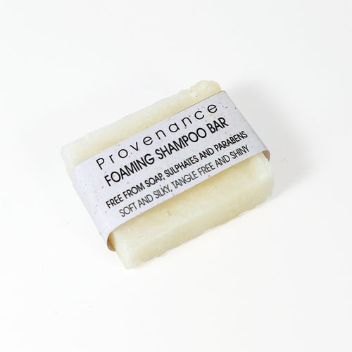Small, white, rectangular bar of foaming shampoo.