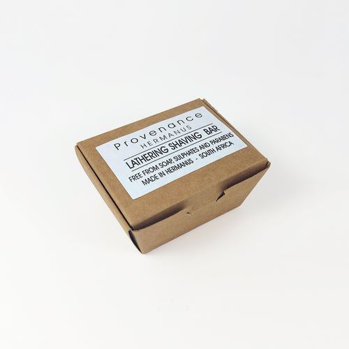 Shaving bar in small brown cardboard box.